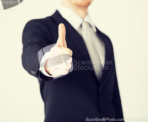 Image of man showing thumbs up