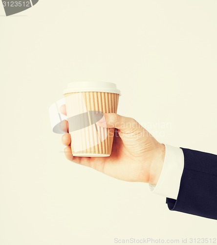 Image of man hand holding take away coffee