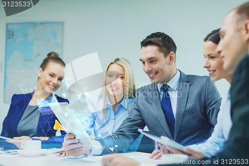 Image of business team with tablet pc having discussion