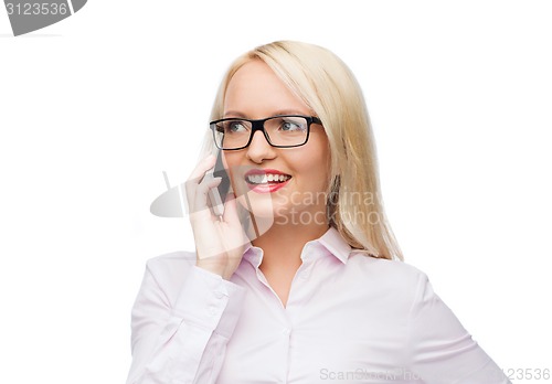 Image of smiling businesswoman calling on smartphone