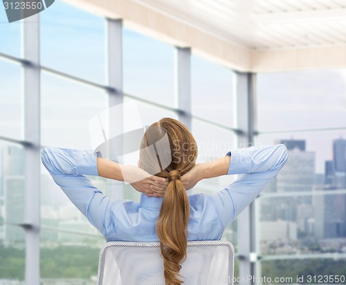 Image of businesswoman sitting on chair from back