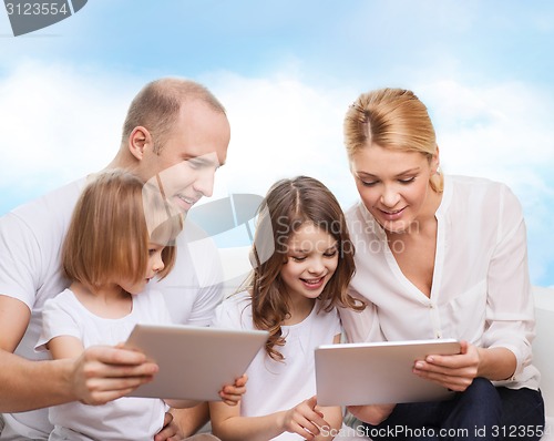 Image of happy family with tablet pc computers