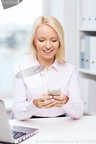 Image of smiling businesswoman or student with smartphone