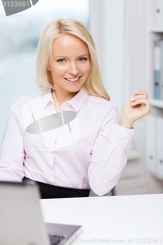 Image of smiling businesswoman or student with laptop