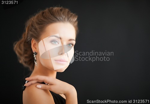 Image of woman with diamond earrings