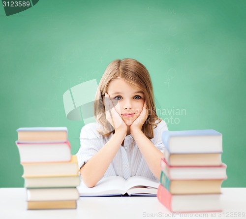 Image of happy student girl with books at school