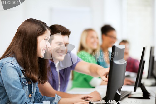 Image of students with computers studying at school