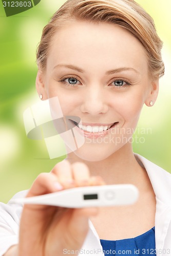 Image of happy female doctor face with thermometer