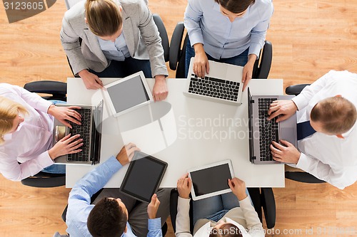 Image of business team with laptop and tablet pc