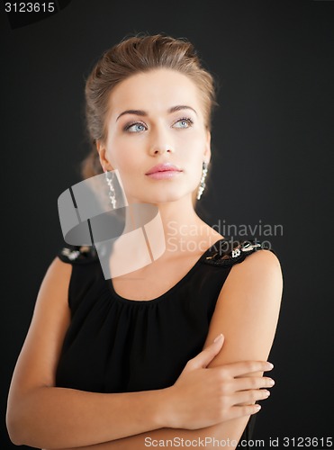 Image of woman with diamond earrings