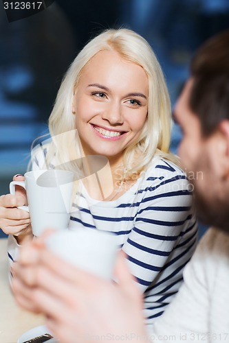 Image of happy couple meeting and drinking tea or coffee