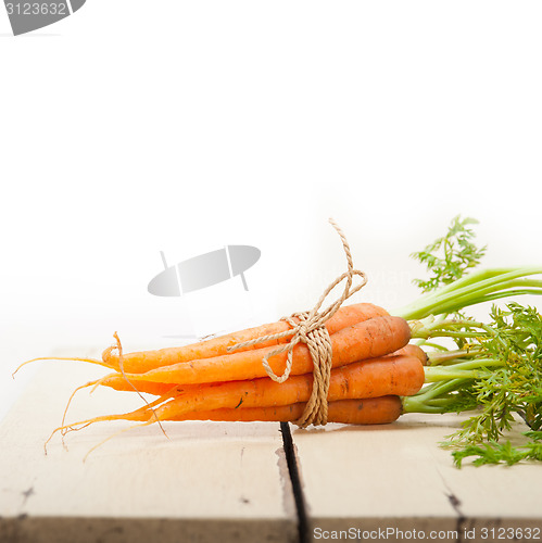 Image of baby carrots bunch tied with rope