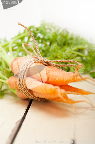 Image of baby carrots bunch tied with rope