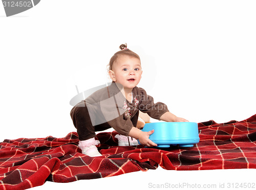 Image of Baby playing with toy's.