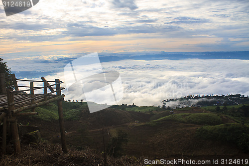 Image of sea of fog with forests as foreground