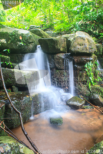 Image of waterfall and rocks covered with moss