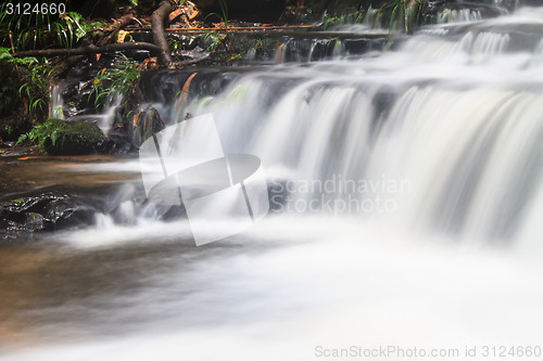 Image of waterfall and rocks covered with moss