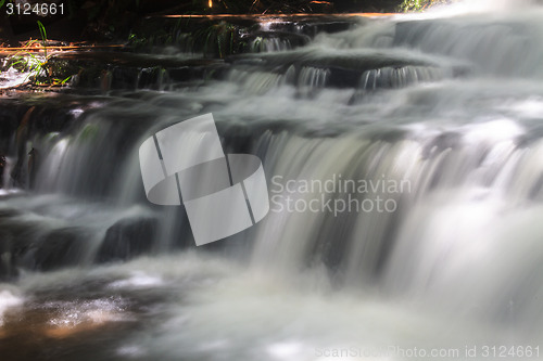 Image of waterfall and rocks covered with moss