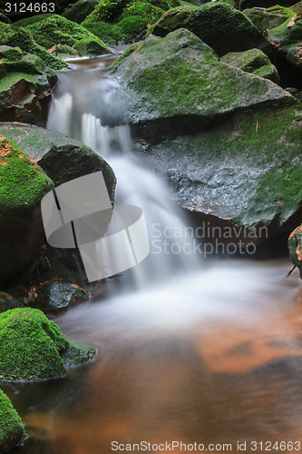 Image of waterfall and rocks covered with moss