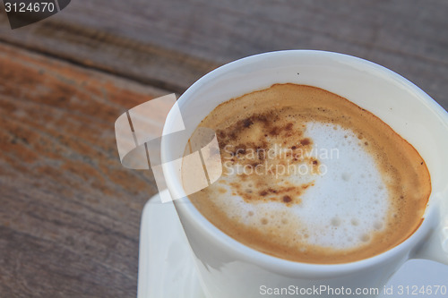 Image of  cappuccino coffee on wooden table