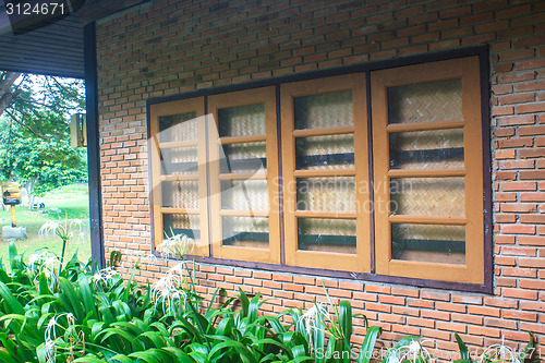 Image of windows  on a red brick wall