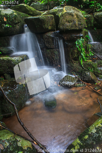 Image of waterfall and rocks covered with moss