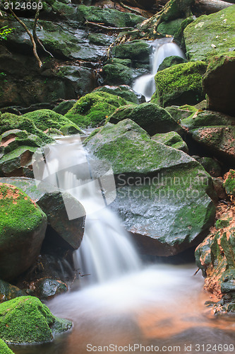 Image of waterfall and rocks covered with moss