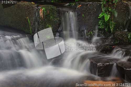 Image of waterfall and rocks covered with moss