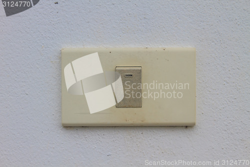 Image of Light switch on the old wall 