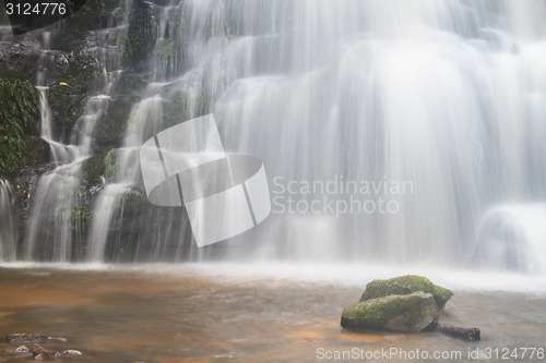 Image of waterfall and rocks covered with moss