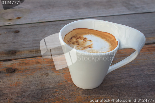 Image of  cappuccino coffee on wooden table