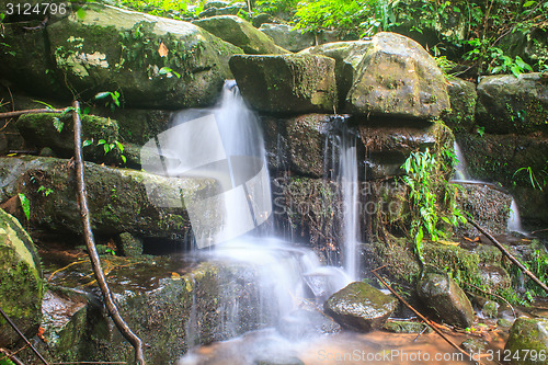 Image of waterfall and rocks covered with moss