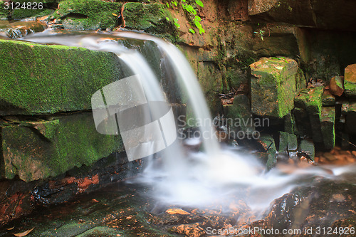 Image of waterfall and rocks covered with moss