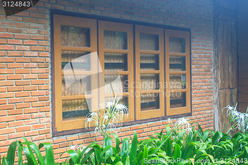 Image of windows  on a red brick wall