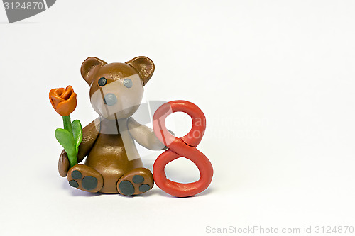 Image of Plasticine bear with flower and eight figure