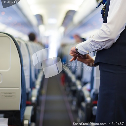 Image of Stewardess on the airplane.