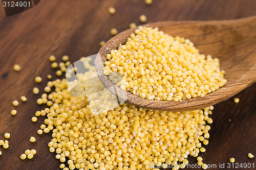 Image of Millet on wooden spoon