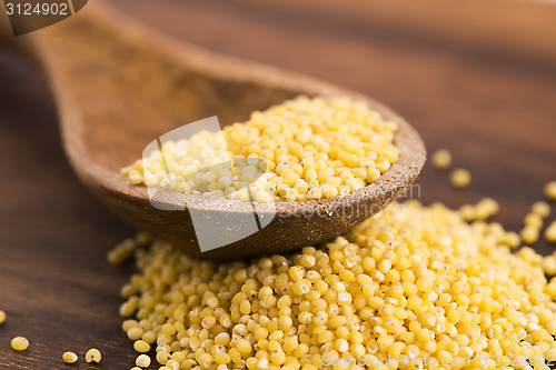 Image of Millet on wooden spoon