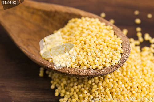 Image of Millet on wooden spoon