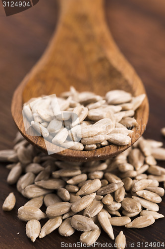 Image of Sunflower seed with a wooden spoon