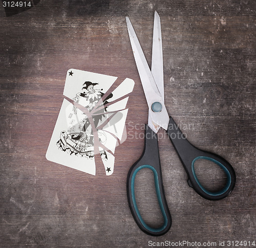 Image of Concept of addiction, card with scissors