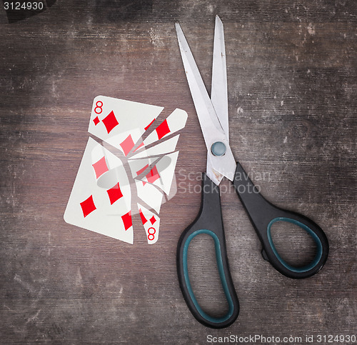 Image of Concept of addiction, card with scissors