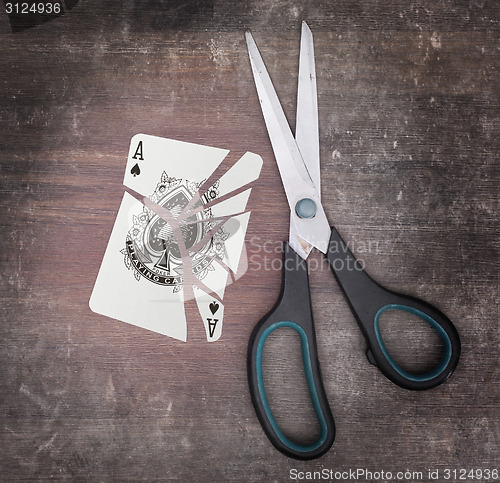 Image of Concept of addiction, card with scissors