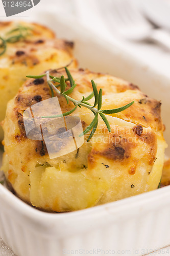 Image of potato gratin with fresh rosemary