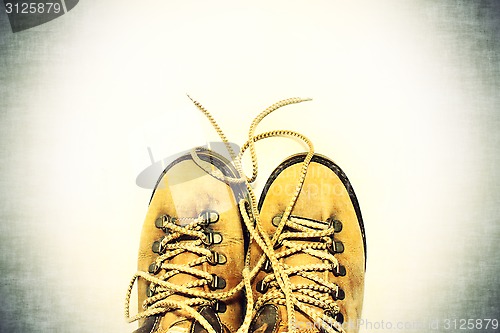 Image of White background with yellow shoes