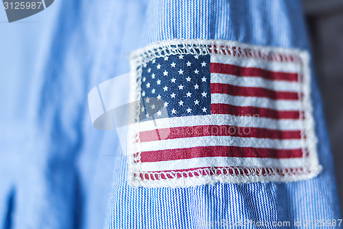 Image of Stripe of USA flag on shirt sleeve 