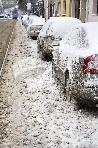 Image of Parked Cars covered with snow