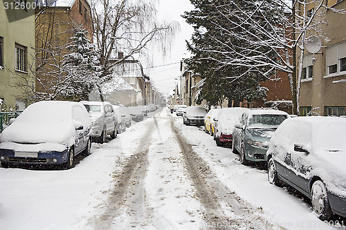 Image of Parked Cars covered with snow