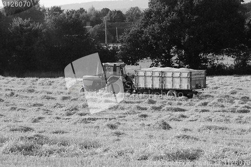 Image of Tractor with a trailer full of grain