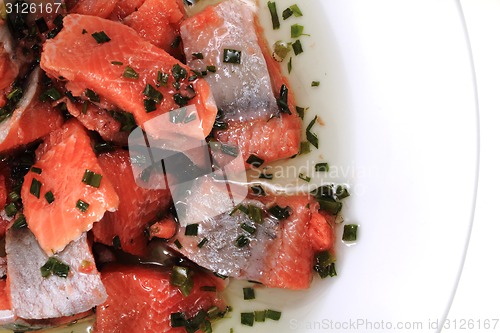 Image of salmon fish with green herbs